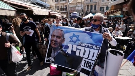 Netanyahu tries to inoculate himself against defeat as Israel's voters head to polls in pandemic
