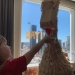 This family built a massive dinosaur out of take-out containers during their hotel quarantine