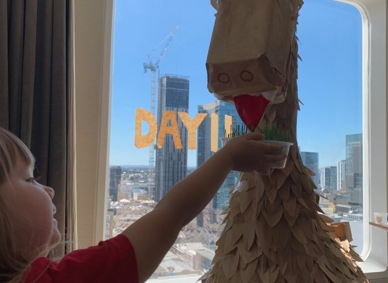 This family built a massive dinosaur out of take-out containers during their hotel quarantine