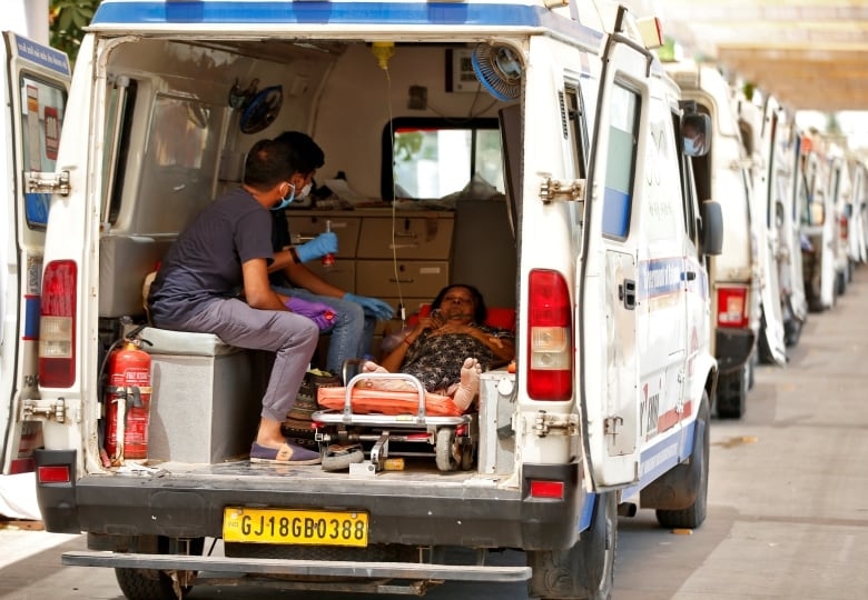 COVID-19 surge slams India's health system, death toll tops 200,000