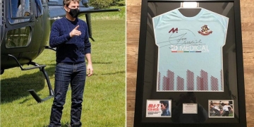 Covid: Tom Cruise signs shirts for football club on movie set