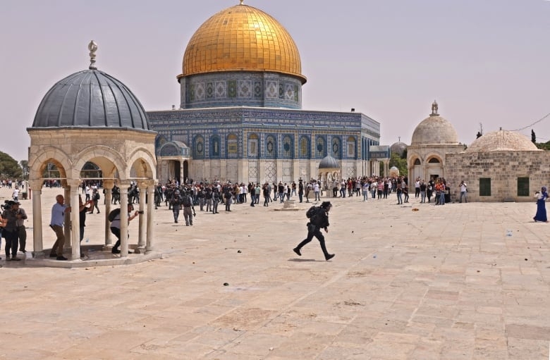 Palestinians claim victory in ceasefire as Israel issues warning to Hamas