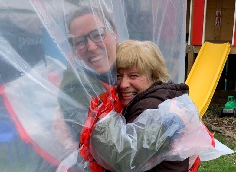 Hug Glove hanging sheet rolls out for safe embrace