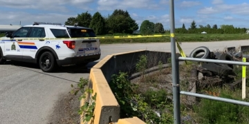 Man arrested after human remains found burning in Surrey ditch: police
