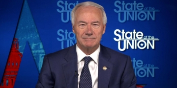 Arkansas' governor defends decision to approve a statewide ban on mask mandates