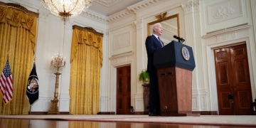 Biden pledges to use 'every tool at our disposal' to limit gas price hikes after imposing new sanctions on Russia